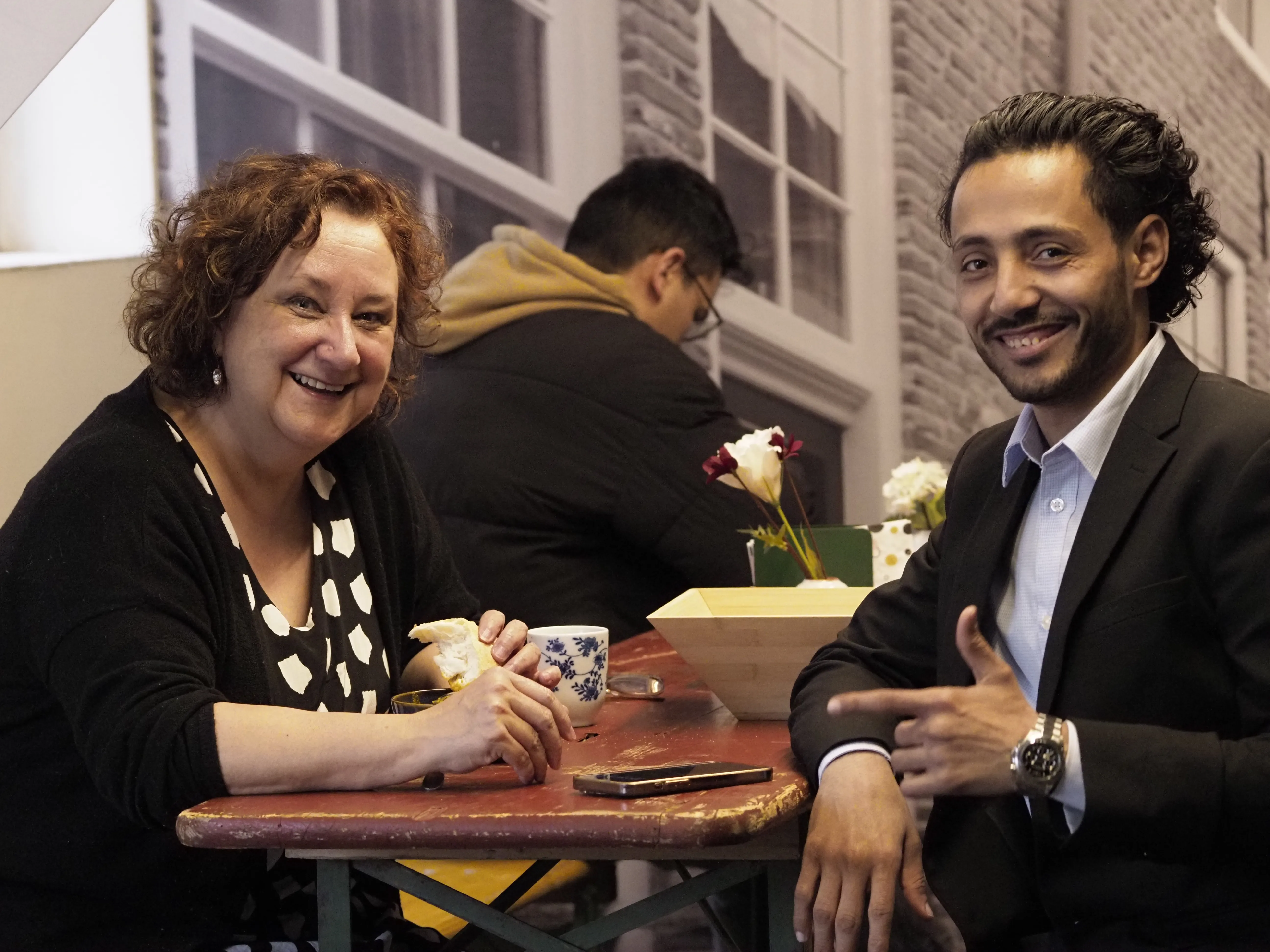 Een leerling met zijn taalmaatje